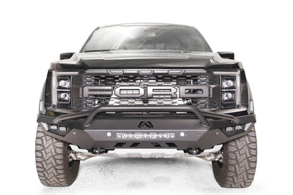 Fab Fours Vengeance front bumper with pre-runner guard on a dark gray Ford Raptor, straight-on front view, showing the pre-runner hoop, center light bar and cube light pods