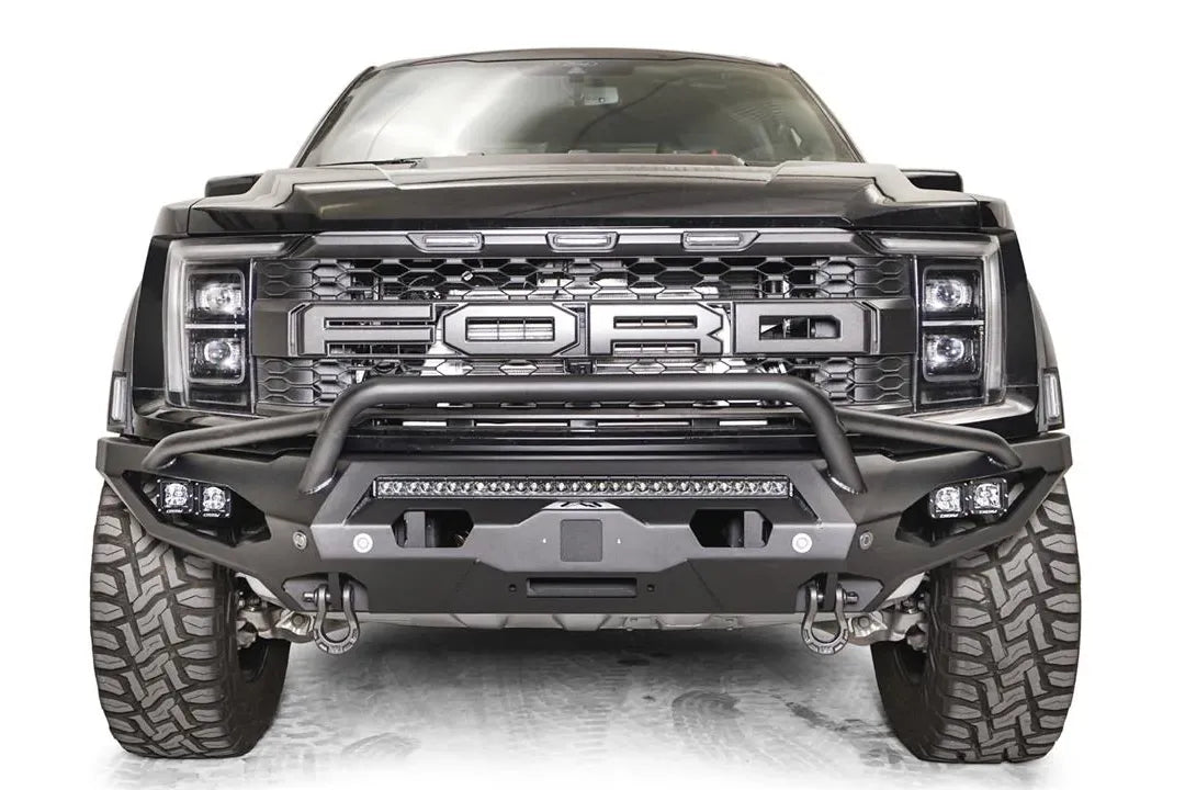 Fab Fours Matrix front winch bumper with pre-runner guard on a gray Ford F-150 Raptor, straight-on front view, showing the pre-runner hoop, center light bar and pod light pockets