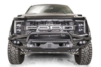 Fab Fours Matrix front winch bumper with pre-runner guard on a gray Ford F-150 Raptor, straight-on front view, showing the pre-runner hoop, center light bar and pod light pockets