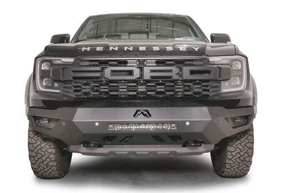 Fab Fours Vengeance front bumper on a gray Ford Ranger Raptor, straight-on front view, showing the center light bar, Fab Fours logo cutout and angular skid section