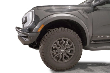 Fab Fours Vengeance front bumper with pre-runner guard on a gray Ford Ranger Raptor, close-up of the front corner, showing the pre-runner tube end, bumper wing and wheel clearance