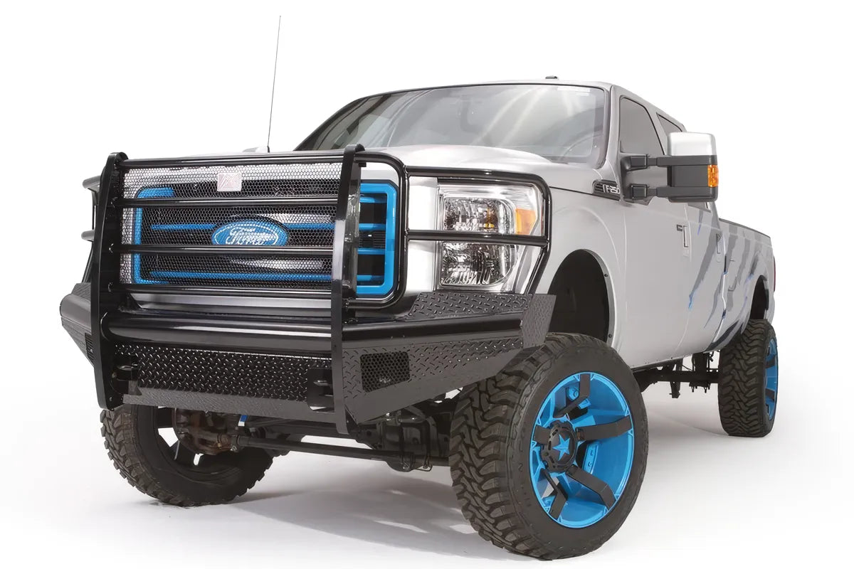 Fab Fours Black Steel front ranch bumper with full guard on a silver Ford Super Duty, front driver-side three-quarter view, showing the full grille guard, diamond-plate face and headlight hoops
