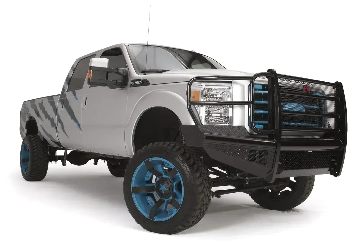 Fab Fours Black Steel front ranch bumper with full guard on a silver Ford Super Duty, front passenger-side three-quarter view, showing the full tubular grille guard, diamond-plate face and bumper wing