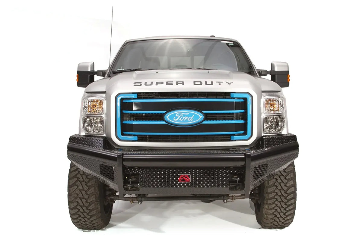 Fab Fours Black Steel front ranch bumper on a silver Ford Super Duty, straight-on front view, showing the diamond-plate face, wraparound wings and center logo plate