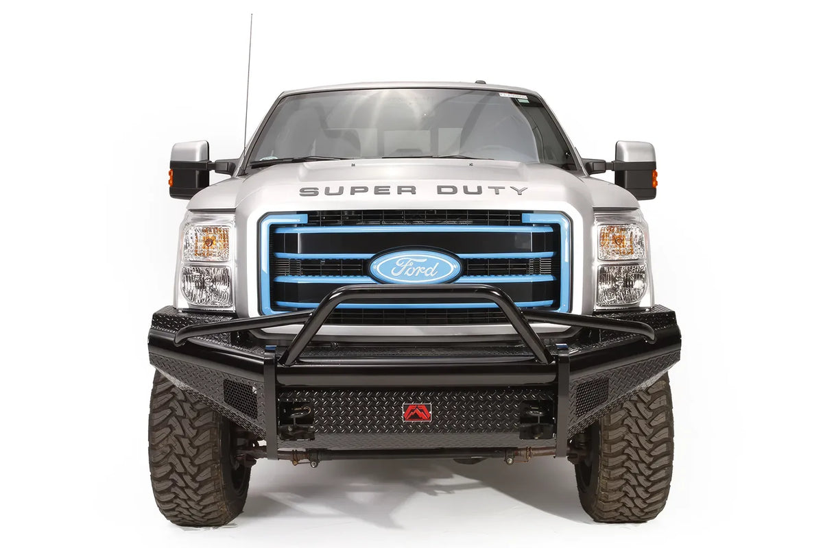Fab Fours Black Steel front ranch bumper with pre-runner guard on a silver Ford Super Duty, straight-on front view, showing the tubular pre-runner hoop, diamond-plate face and center logo plate