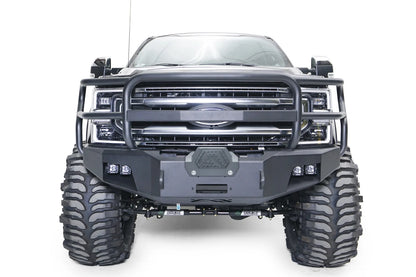 Fab Fours Premium winch front bumper with full guard on a gray Ford Super Duty, straight-on front view, showing the full grille guard, center winch cover and pairs of integrated lights