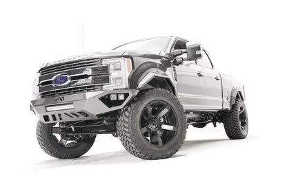 Fab Fours Open Fender front bumper on a gray Ford Super Duty, front driver-side three-quarter view, showing the center LED light bar, cube light pods, and the open-fender wing design