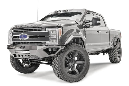 Fab Fours Open Fender front bumper on a gray Ford Super Duty, front driver-side three-quarter view, showing the center LED light bar, cube light pods, and the open-fender wing design
