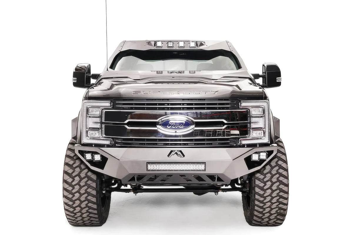 Fab Fours Open Fender front bumper on a gray Ford Super Duty, straight-on front view, showing the center LED light bar, cube light pods, and the open-fender wing design