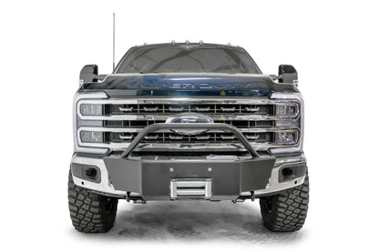Fab Fours winch mount with pre-runner hoop on a blue and gray two-tone Ford Super Duty F-250/F-350, straight-on front view, showing the tubular pre-runner hoop, the winch mount plate with fairlead and the factory bumper integration