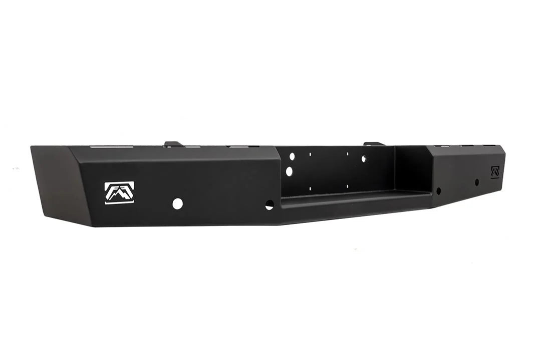 Fab Fours Red Steel rear bumper for Ford Super Duty, angled driver-side view showing the angled end cap, Fab Fours logo cutout and the recessed center pocket