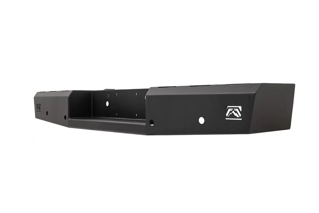 Fab Fours Red Steel rear bumper for Ford Super Duty, angled passenger-side view showing the formed steel end, logo cutout and mounting holes