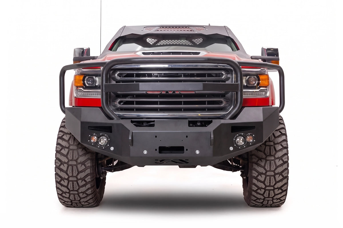 Fab Fours Premium winch front bumper with full grille guard on a red GMC Sierra HD
