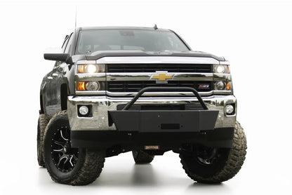 Fab Fours winch mount with pre-runner guard on a black Chevrolet Silverado 2500HD, front view, showing the pre-runner hoop, winch plate and factory chrome bumper integration