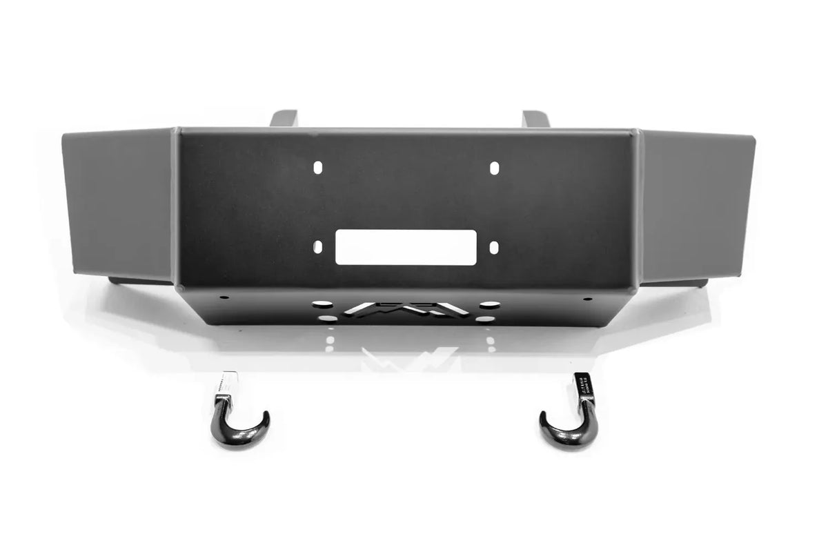 Fab Fours winch mount in black powder coat, straight-on front view, showing winch fairlead opening, center logo cutout, tow hooks