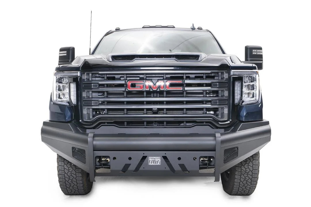 Fab Fours Black Steel Elite front bumper on a blue GMC Sierra 2500HD/3500HD, straight-on front view, showing Elite badge, slotted skid plate, mesh end inserts, top tube