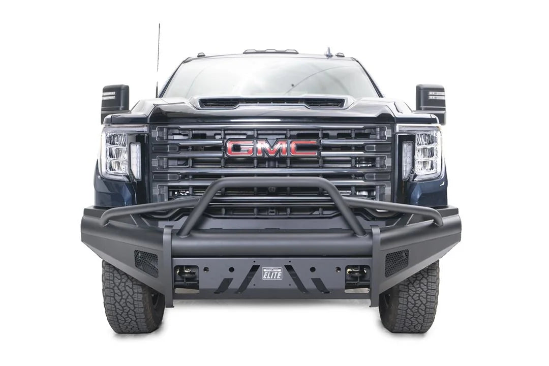 Fab Fours Black Steel Elite front bumper with pre-runner guard on a blue GMC Sierra 2500HD/3500HD, straight-on front view, showing pre-runner hoop, Elite badge, slotted skid plate, mesh end inserts