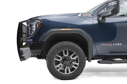 Fab Fours Black Steel front bumper with full guard on a blue GMC Sierra 2500HD/3500HD, close-up of the front corner, showing full guard side hoop, diamond-plate end, wheel-well clearance