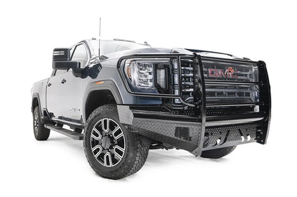 Fab Fours Black Steel front bumper with full guard on a blue GMC Sierra 2500HD/3500HD, front passenger-side three-quarter view, showing full grille guard, diamond-plate finish, mesh end inserts