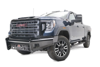 Fab Fours Black Steel front bumper on a blue GMC Sierra 2500HD/3500HD, front driver-side three-quarter view, showing diamond-plate finish, top tube, mesh end inserts, Fab Fours badge