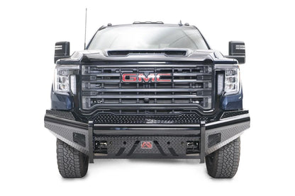 Fab Fours Black Steel front bumper on a blue GMC Sierra 2500HD/3500HD, straight-on front view, showing diamond-plate finish, top tube, mesh end inserts, Fab Fours badge