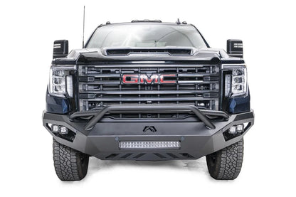 Fab Fours Vengeance front bumper with pre-runner guard on a blue GMC Sierra 2500HD/3500HD, straight-on front view, showing pre-runner hoop, integrated light bar, cube light pods, angular skid plate
