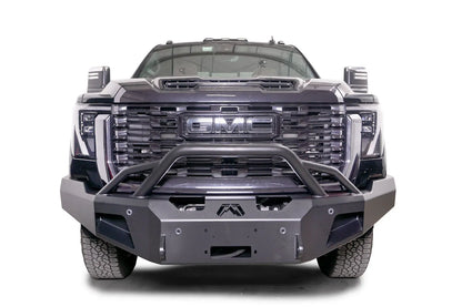 Fab Fours Premium Winch front bumper with pre-runner guard on a black GMC Sierra 2500HD/3500HD, straight-on front view, showing pre-runner hoop, winch mount opening, angled end caps