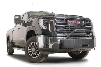 Fab Fours winch mount with pre-runner guard on a black GMC Sierra 2500HD/3500HD, front passenger-side three-quarter view, showing pre-runner hoop, winch plate, factory bumper integration