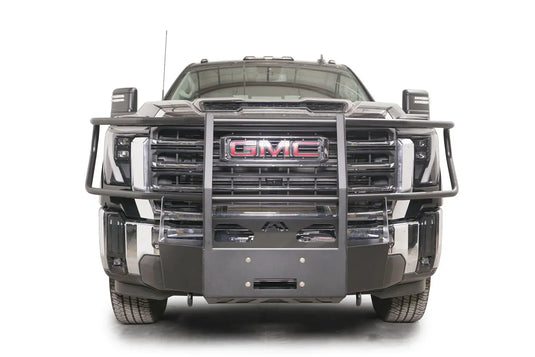 Fab Fours winch mount with full guard on a black GMC Sierra 2500HD/3500HD, straight-on front view, showing full guard uprights, wraparound headlight hoops, winch plate