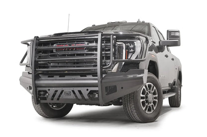 Fab Fours Black Steel Elite front bumper with full guard on a black GMC Sierra 2500HD/3500HD, front driver-side three-quarter view, showing full grille guard, Elite badge, slotted skid plate, mesh end inserts