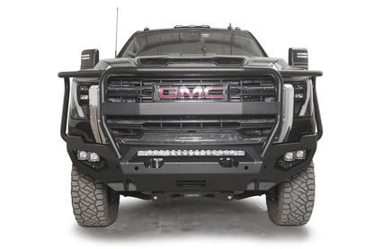 Fab Fours Matrix front bumper with full guard on a dark gray GMC Sierra 2500HD/3500HD, straight-on front view, showing full guard hoop, integrated light bar, cube light pods