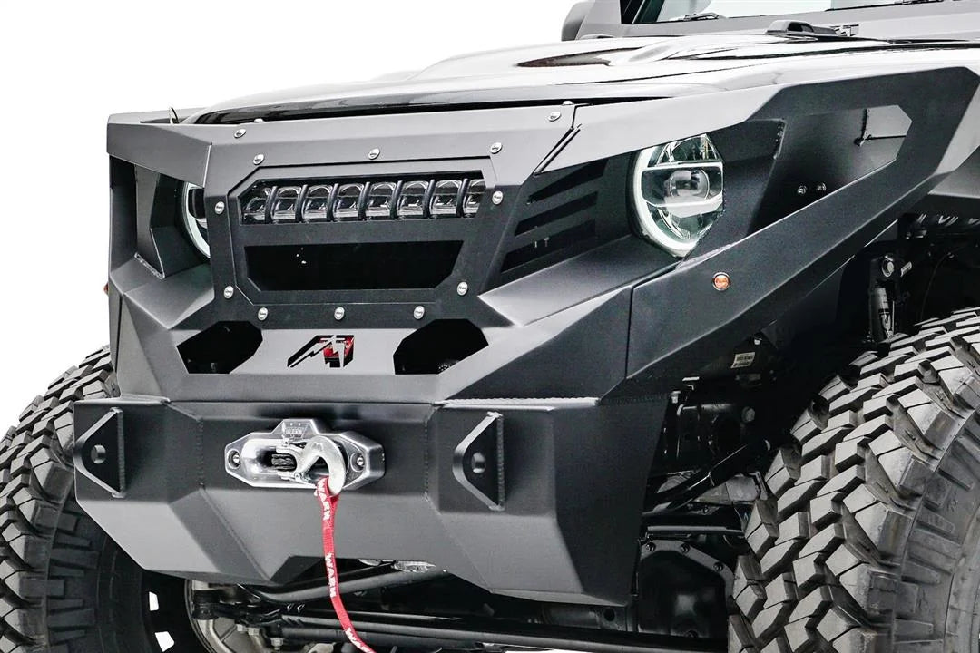 Close-up of Fab Fours light bar mount with LED light bar in a Fab Fours Grumper on a Jeep Wrangler JL, driver-side angle, with Warn winch