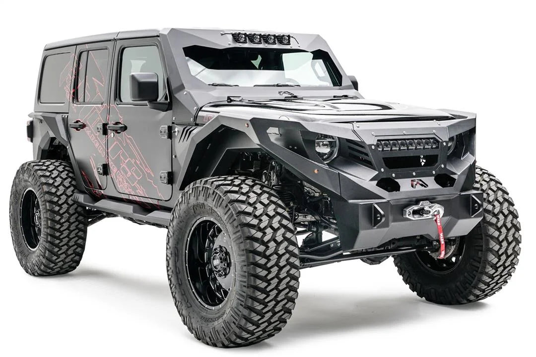 Fab Fours Grumper with light bar mount and LED light bar on a lifted gray Jeep Wrangler JL, passenger-side front three-quarter view, with Warn winch