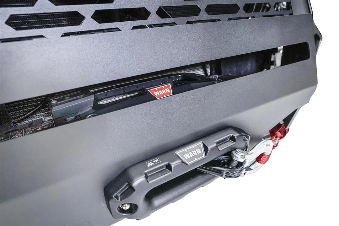 Close-up of Warn winch and fairlead mounted inside a Fab Fours Grumper front winch bumper