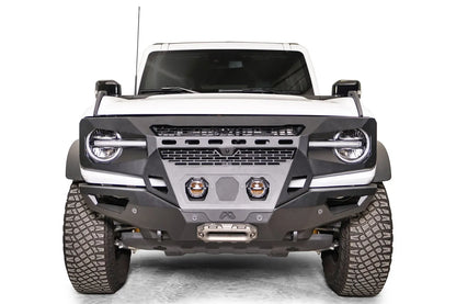 Fab Fours Grumper front bumper on a white Ford Bronco, front view, with two center pod lights and winch fairlead