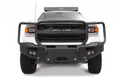 Fab Fours Premium heavy duty winch front bumper with full grille guard on a white GMC Sierra 1500