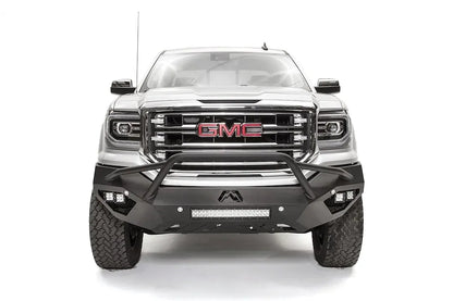 Fab Fours Vengeance front bumper with pre-runner guard on a white GMC Sierra 1500, straight-on front view, showing the pre-runner hoop, corner pod lights and center light bar