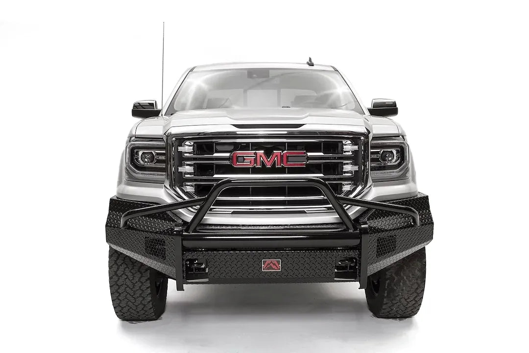 Fab Fours Black Steel front bumper with pre-runner guard on a white GMC Sierra 1500, straight-on front view, showing the pre-runner hoop, diamond-plate bumper face and light openings