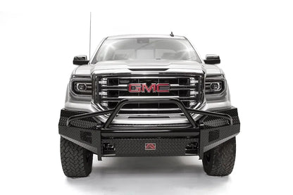 Fab Fours Black Steel front bumper with pre-runner guard on a white GMC Sierra 1500, straight-on front view, showing the pre-runner hoop, diamond-plate bumper face and light openings