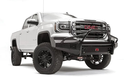 Fab Fours Black Steel front bumper with pre-runner guard on a white GMC Sierra 1500, passenger-side front three-quarter view, showing the pre-runner hoop, diamond-plate bumper face and wrapped end caps