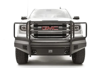 Fab Fours Black Steel Elite front bumper with full guard on a white GMC Sierra 1500, straight-on front view, showing the full grille guard with headlight hoops, smooth plate bumper face and mesh vent openings
