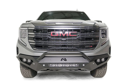 Fab Fours Vengeance front bumper with pre-runner guard on a silver GMC Sierra 1500, straight-on front view, showing the low pre-runner bar, corner pod lights and center light bar