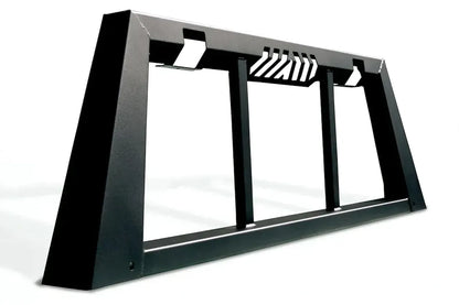 Fab Fours headache rack on a dark pickup, rear three-quarter close-up outdoors, showing the tapered side post, vertical window bars and slotted top rail vents