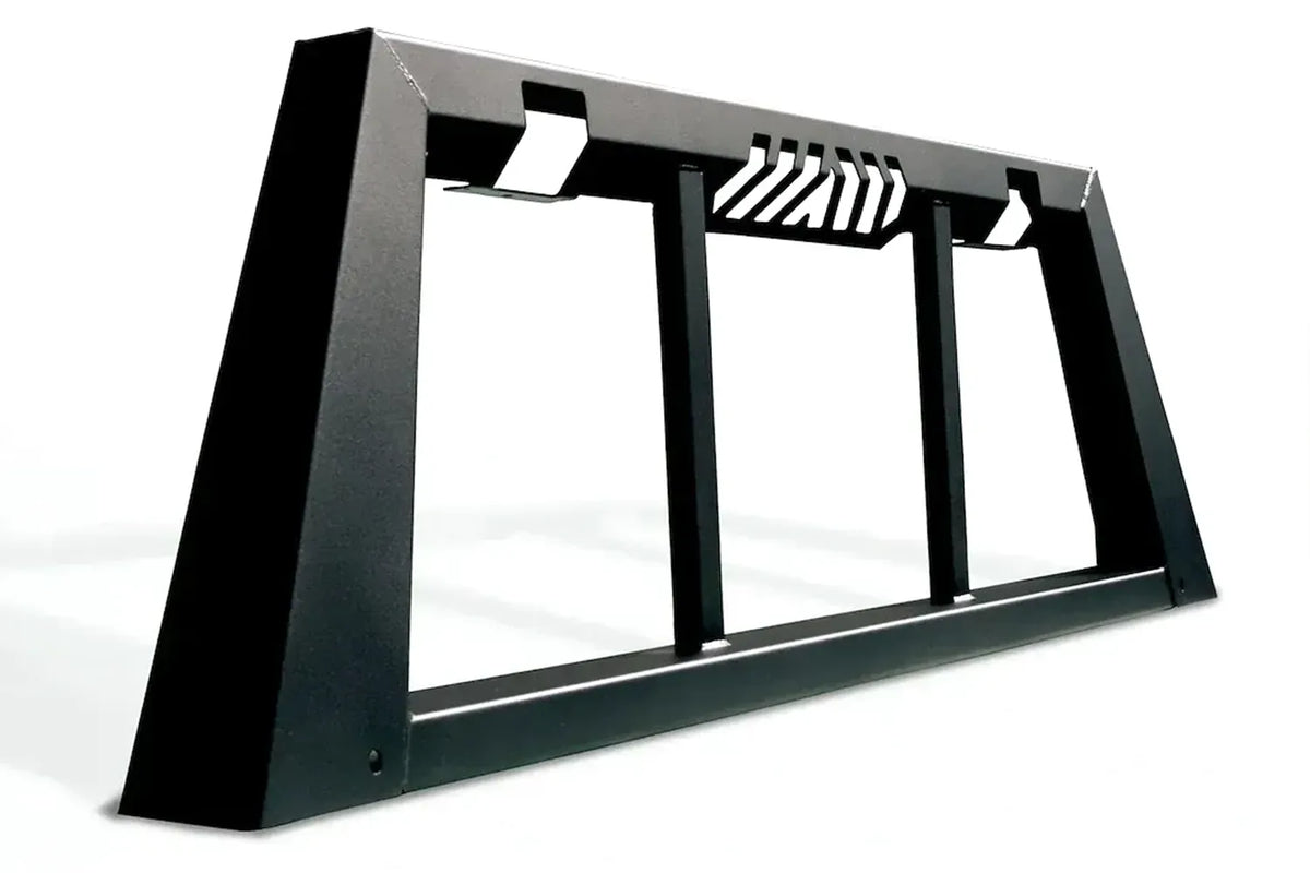 Fab Fours headache rack in black powder coat, angle view, showing the tapered side posts, vertical window bars and slotted top rail vents