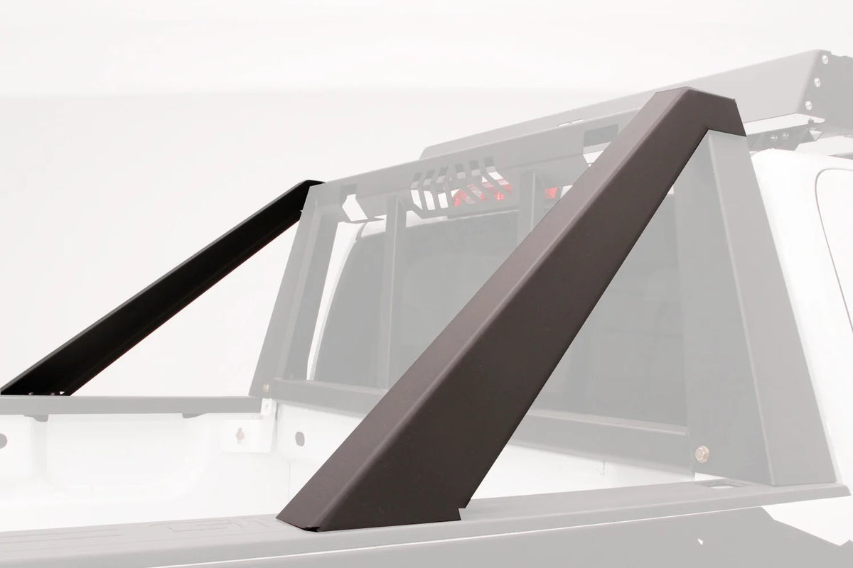 Render of Fab Fours headache rack modifier braces mounted on the bed rails of a white mid-size truck, with the headache rack and cab shown ghosted