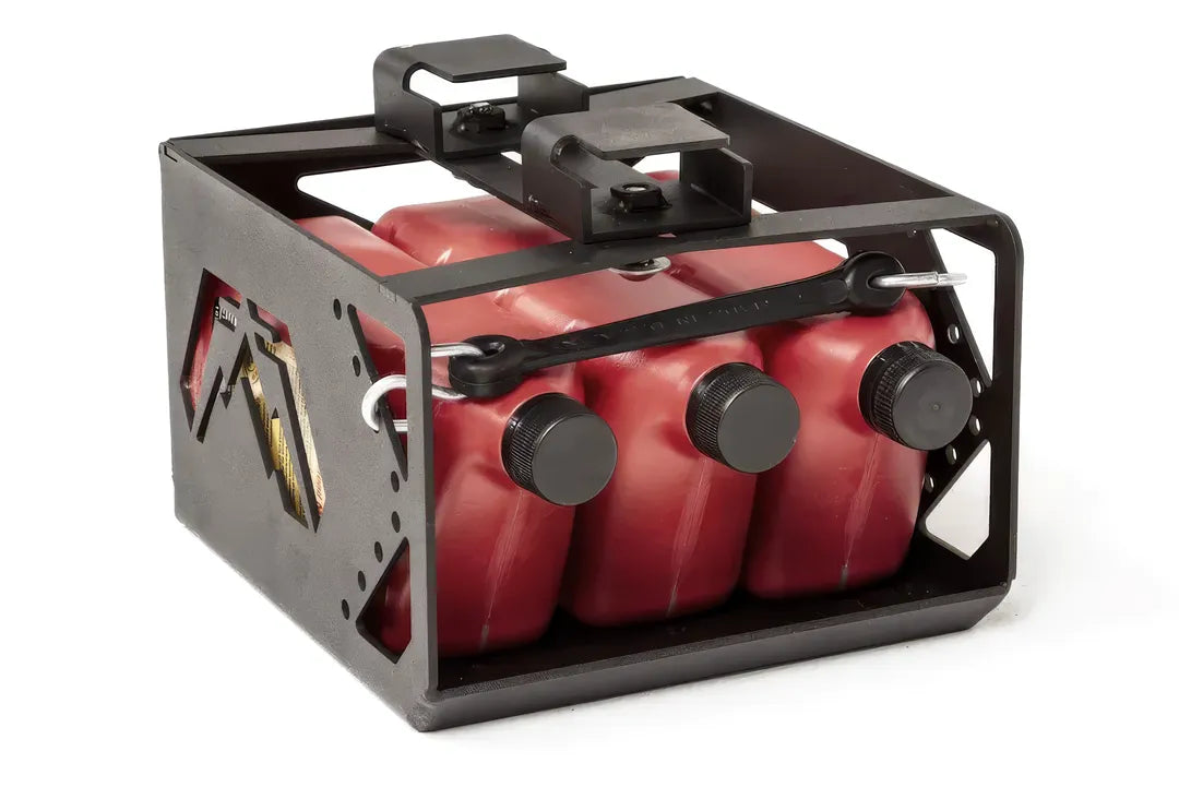 Fab Fours under-seat fluid container for Jeep Wrangler JK, front view showing three red fluid jugs with black caps held in the steel cage by a rubber tie-down strap