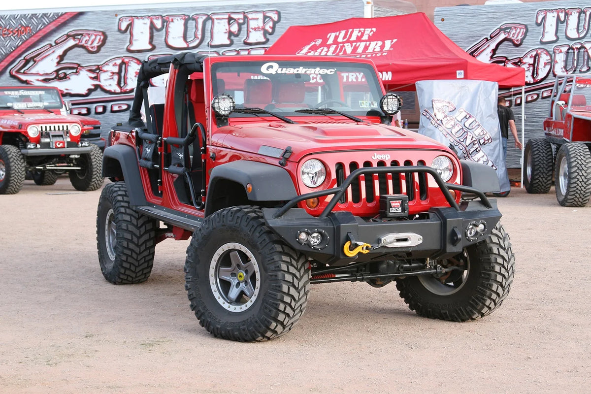 Fab Fours Lifestyle winch bumper on a Jeep Wrangler JK, passenger side view outdoors