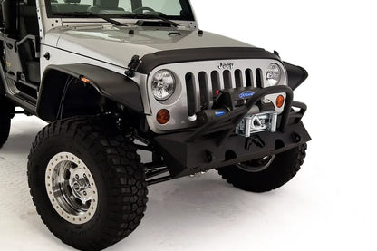 Fab Fours Hardcore Stubby Winch bumper with pre-runner guard on a silver Jeep Wrangler JK, close-up of the front, showing the pre-runner hoop, winch mount and stubby end caps