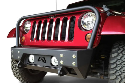 Fab Fours Full Metal Jacket stubby front bumper with full guard on a red Jeep Wrangler JK, front three-quarter close-up, showing the tubular grille hoop, bolted face plate and Fab Fours logo cutout