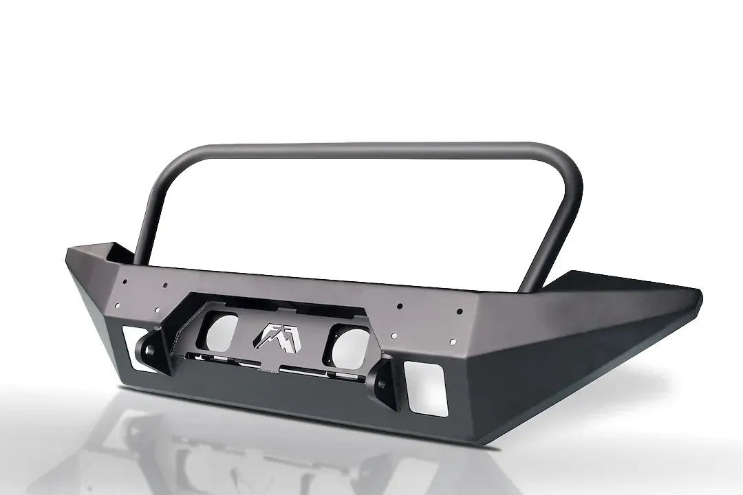Fab Fours Full Metal Jacket full-width front bumper with full guard in black powder coat, angle view, showing the tubular grille hoop, wing-style end caps and Fab Fours logo cutout